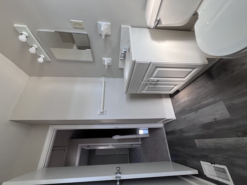 A modern bathroom with a walk-in shower and a toilet.