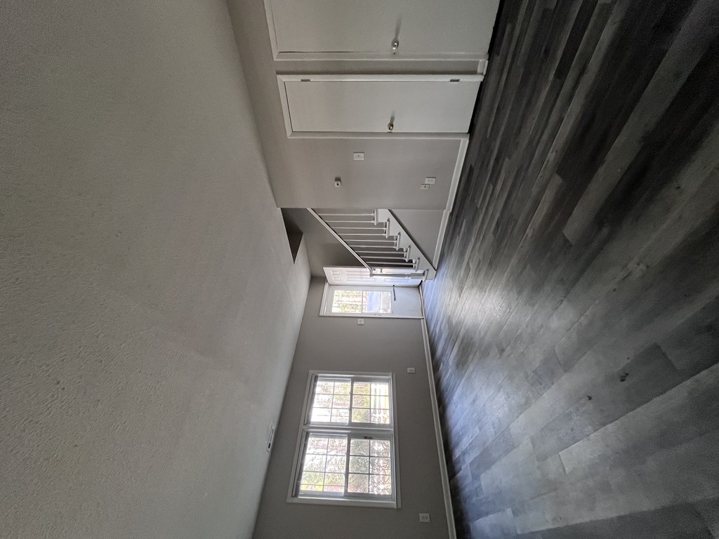 A staircase with a window on the landing.