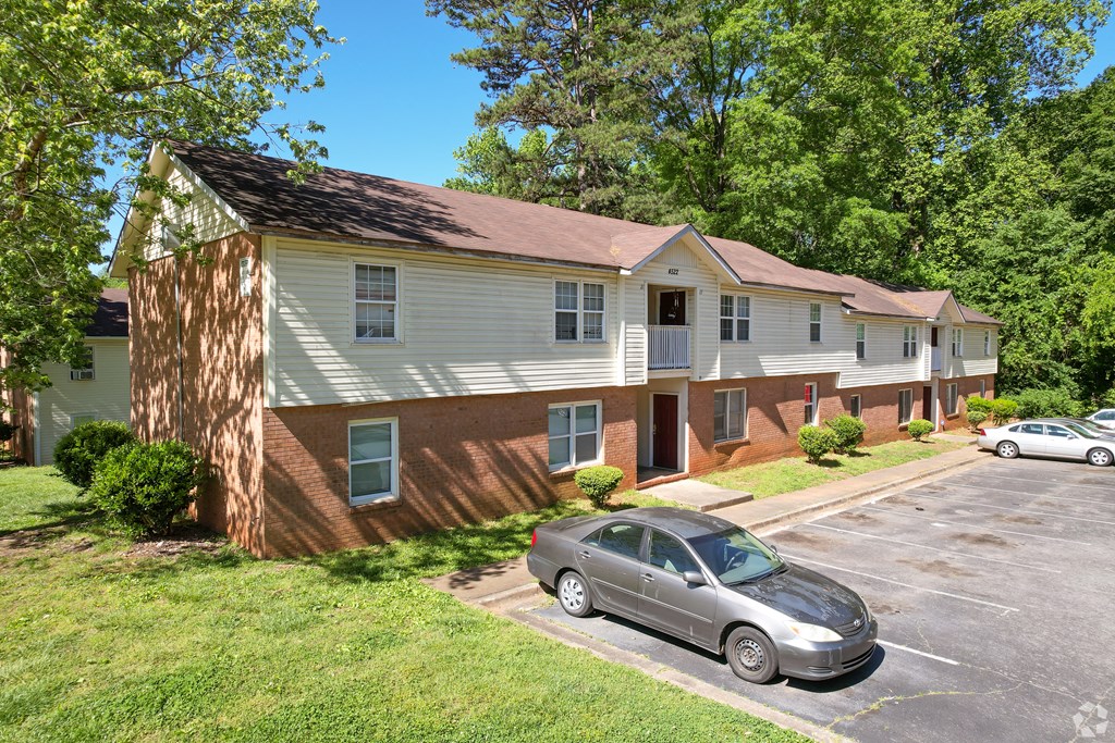 a house with a car parked in a parking lot