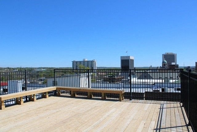 a wooden deck with a bench on top of it