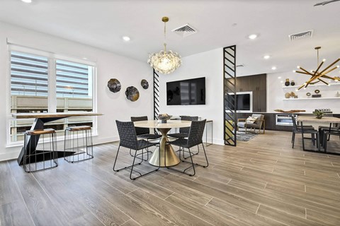 A modern dining room with a wooden table and chairs. at The Palms 1101, Columbia, SC