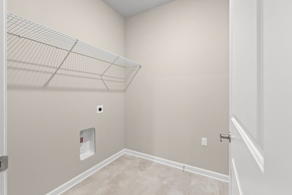 an empty room with a closet and a white door