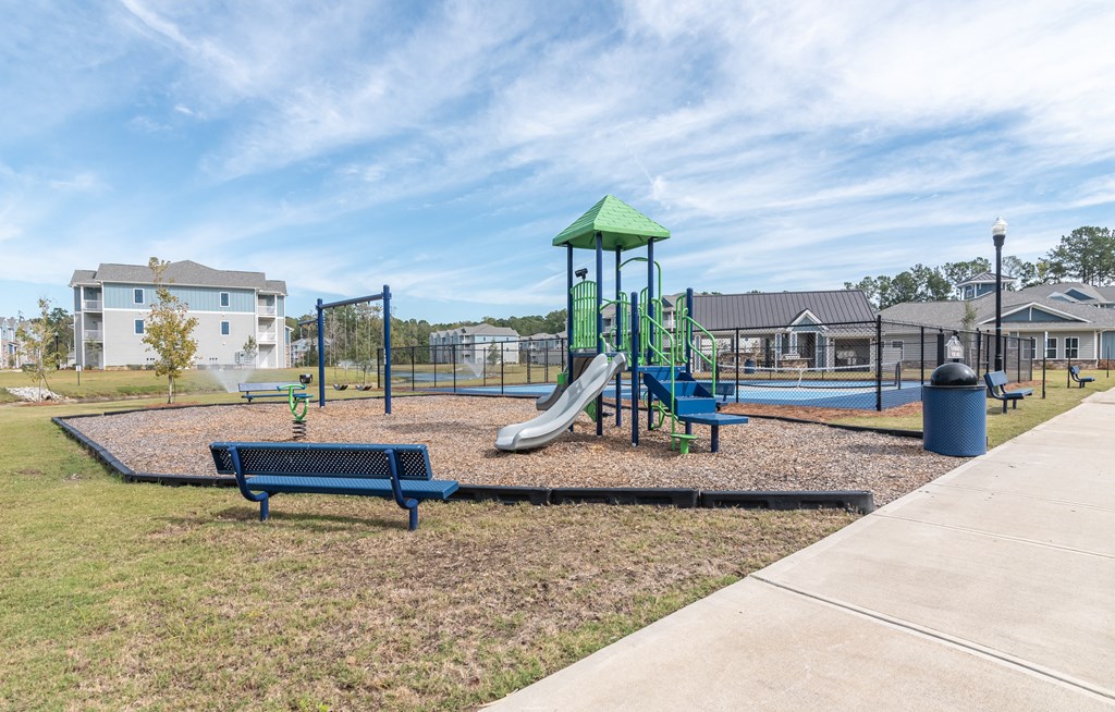 the preserve at ballantyne commons playground with play equipment and benches