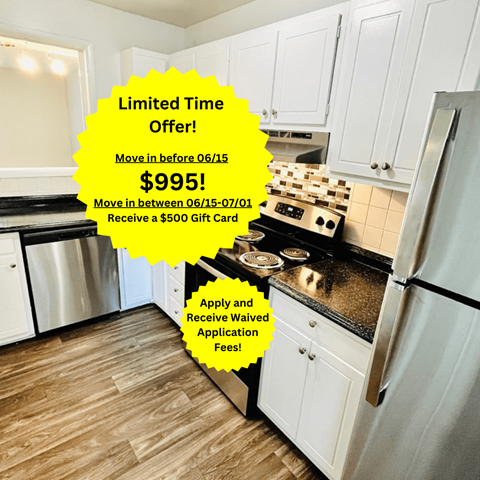 a kitchen with white cabinets and a stainless steel refrigerator