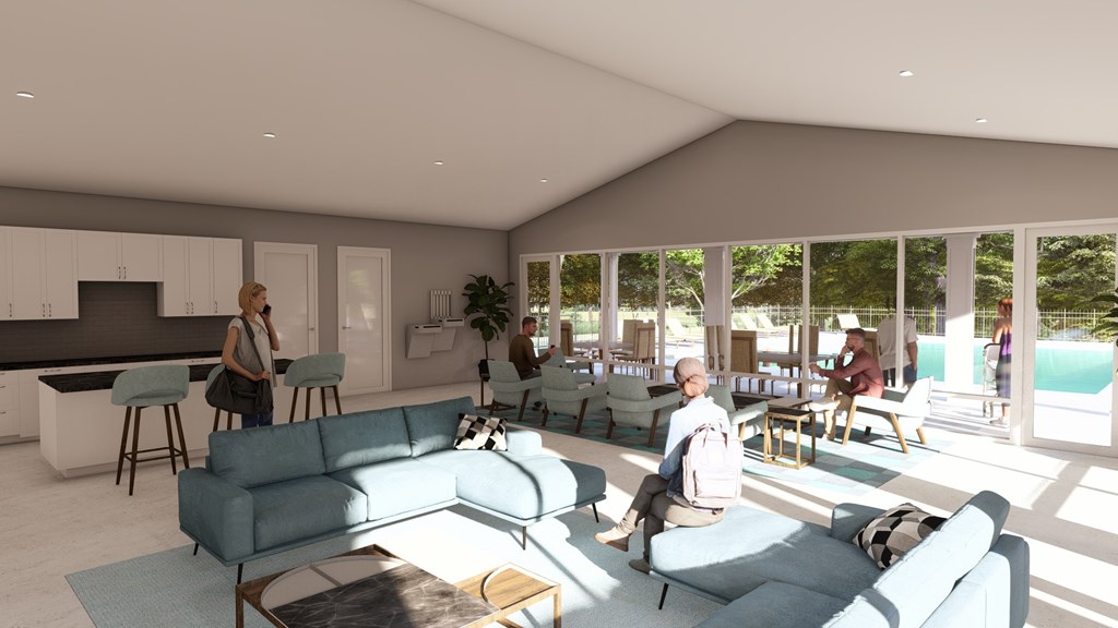 A modern living room with people sitting and standing around.