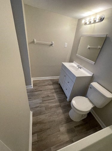 a bathroom with a toilet and a sink and a mirror