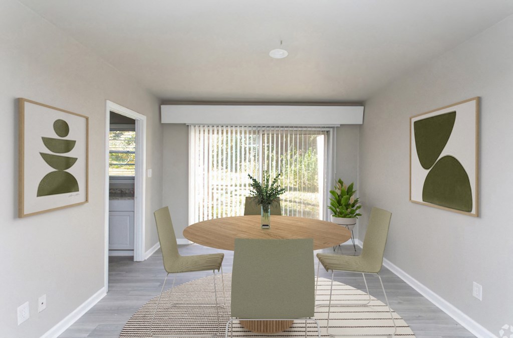 a dining room with a table and chairs and a window