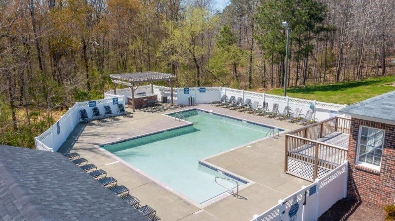 a swimming pool with a fence around it