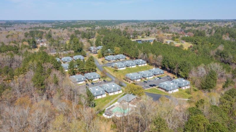 an aerial view of a neighborhood with houses and trees