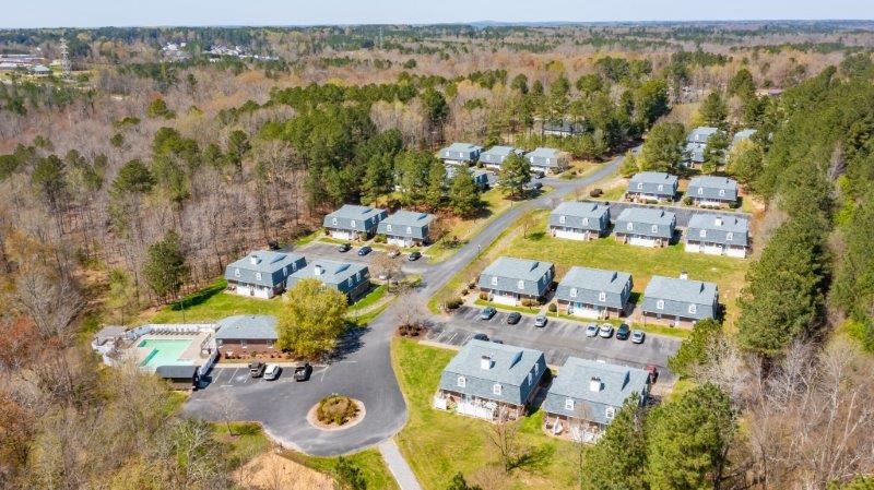 a aerial view of a group of houses in a field