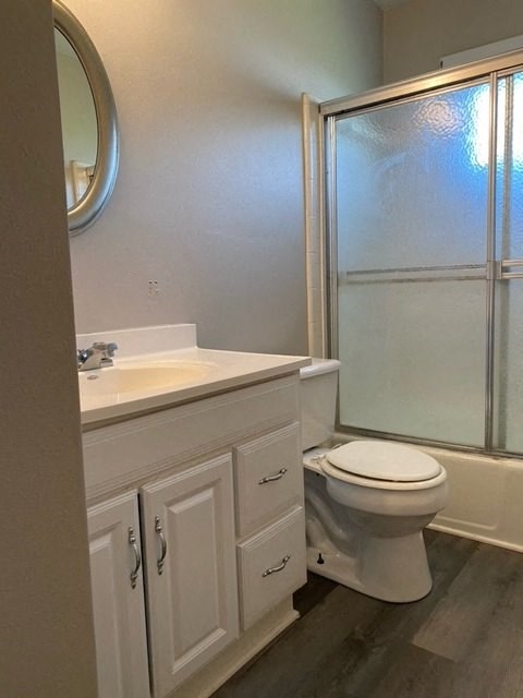a bathroom with a toilet sink and shower