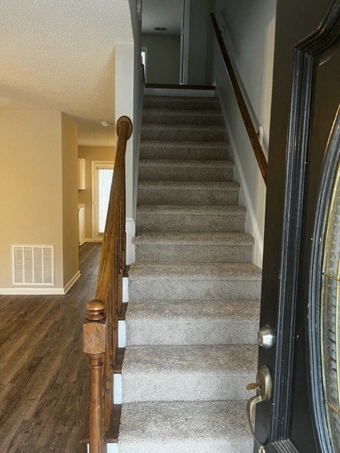 a set of stairs in a house with a door