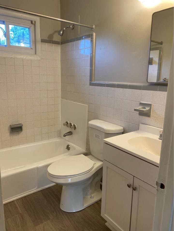 a bathroom with a toilet sink and bathtub