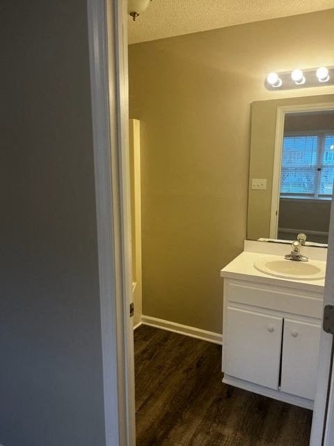 a small bathroom with a sink and a mirror