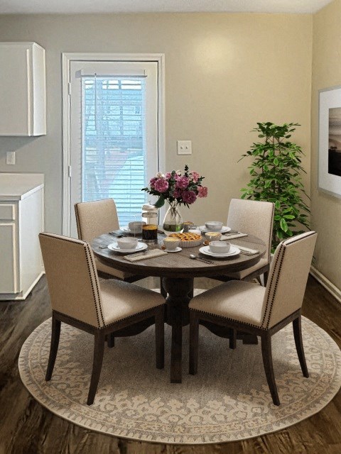 a dining room with a table and chairs