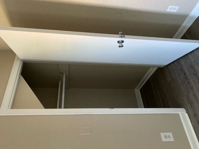 the ceiling is open and the room is empty