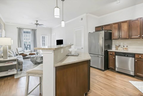 A modern kitchen with wooden cabinets and stainless steel appliances.at Residence at Marina Bay, Irmo, 29063