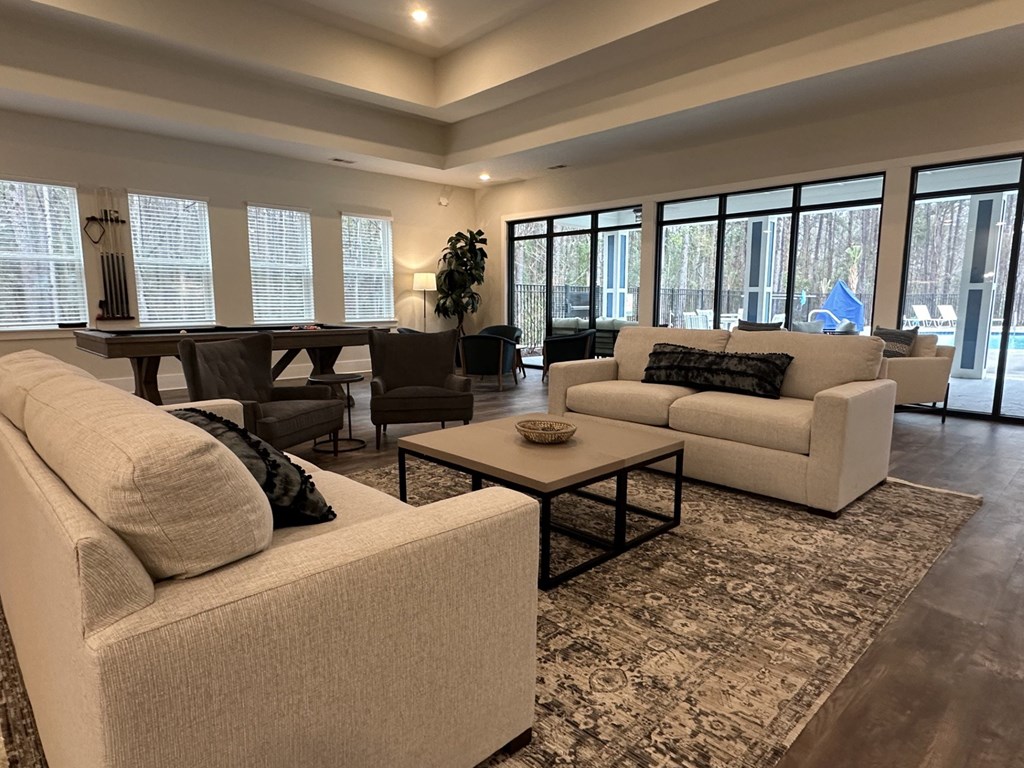 A living room with a white couch and a coffee table.