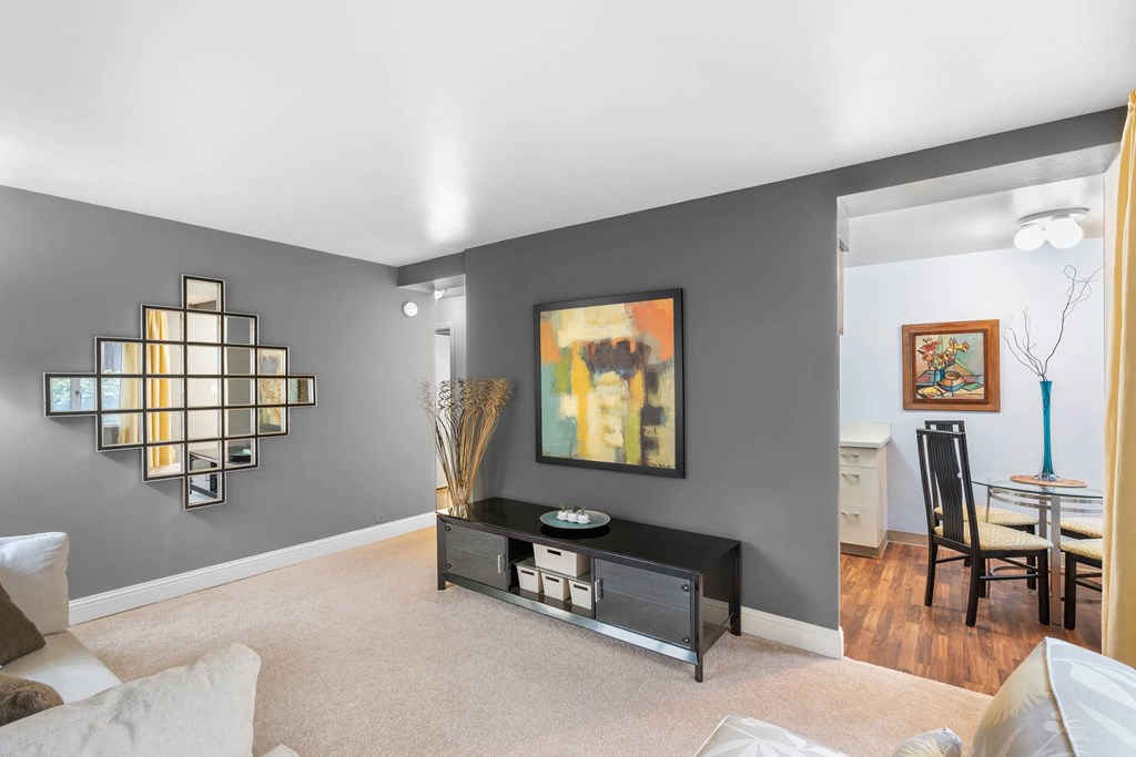 a living room with a couch and a table at Celio Apartments, Portland, 97205