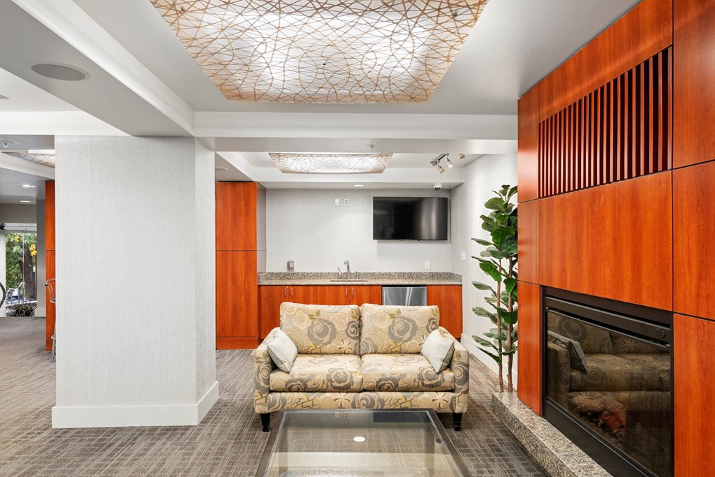 a living room with a couch and a fireplace