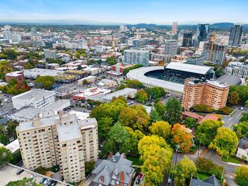 an aerial view of a city with buildings and trees