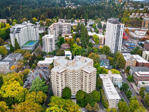 an aerial view of a city with buildings and trees at Celio Apartments, Portland