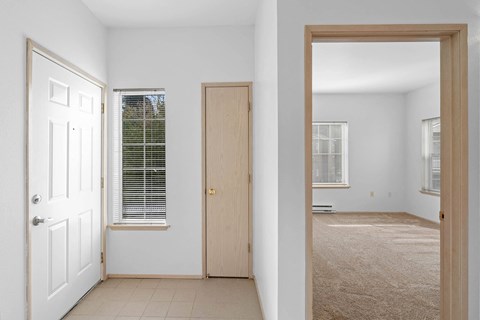 Entryway with tile flooring and closet storage at Oriel Apartments, Portland, 97225
