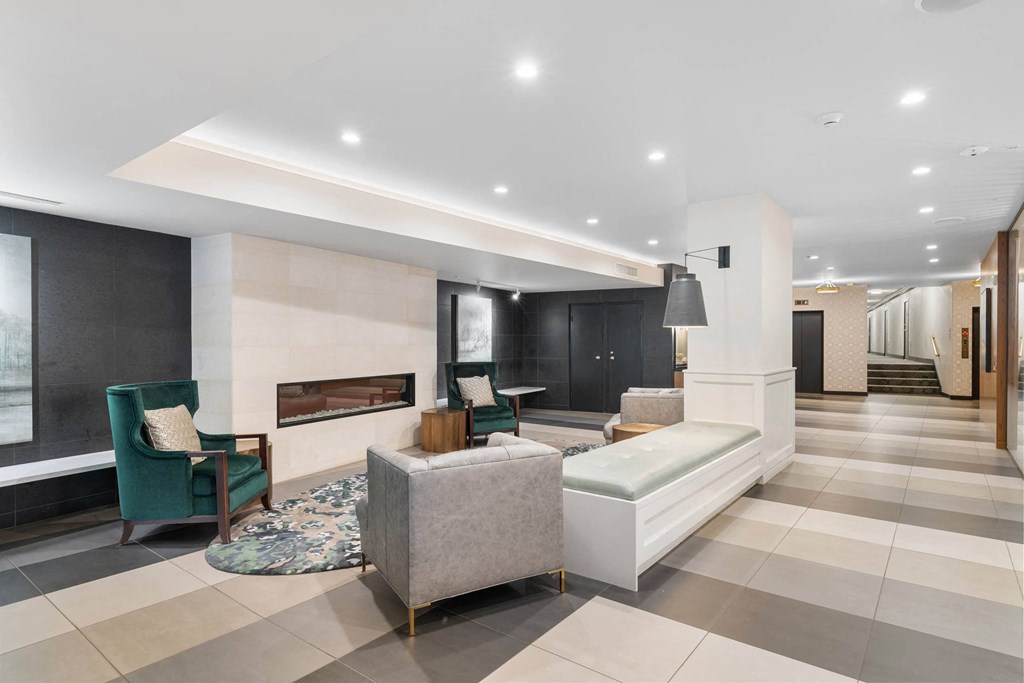 a living room with a couch and chairs and a fireplace at Vista St. Clair, Portland, OR, 97205