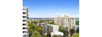 an aerial view of a city with tall buildings and trees at Vista St. Clair, Portland, OR