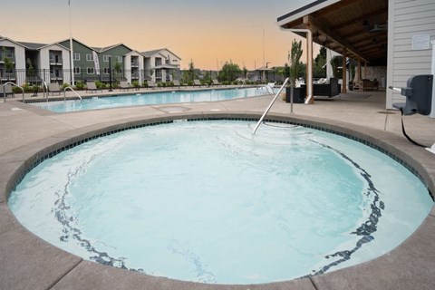 Hot tub and pool with covered pavilion at Sonder Fields Apartments, Happy Valley