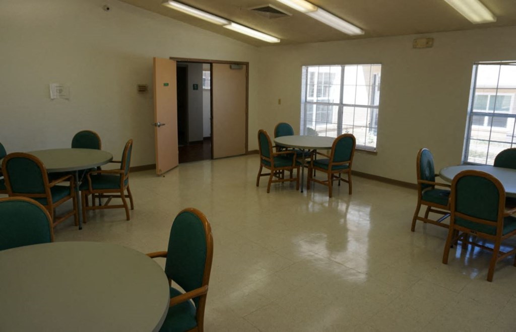 a dining room with tables and chairs