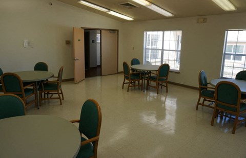 a dining room with tables and chairs