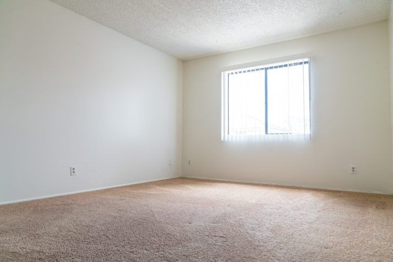 an empty room with a window in it