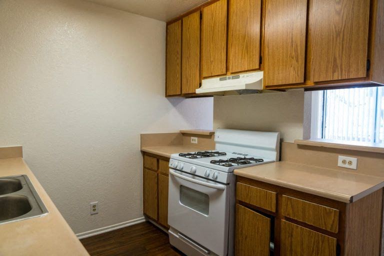 a kitchen with a stove and a sink