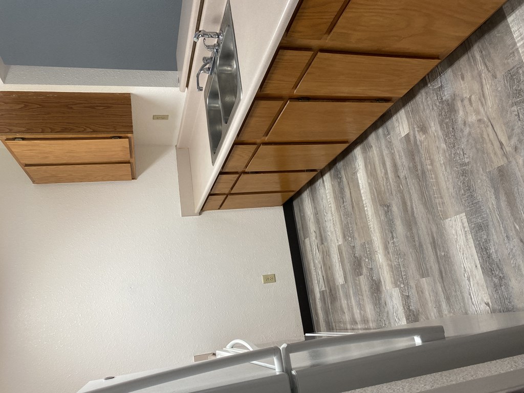 a kitchen with a counter top and a window