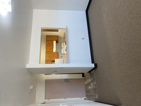 a view of the bathroom from the living room with the window open