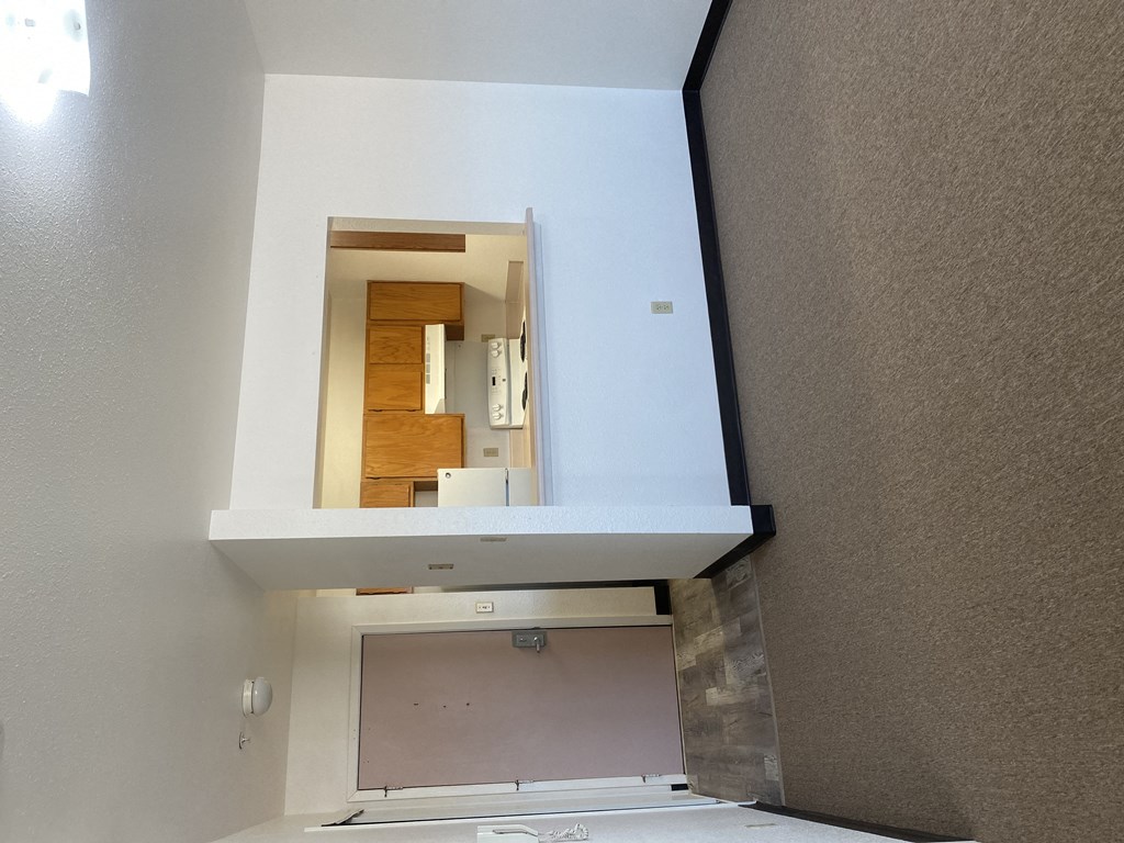 a view of the bathroom from the living room with the window open