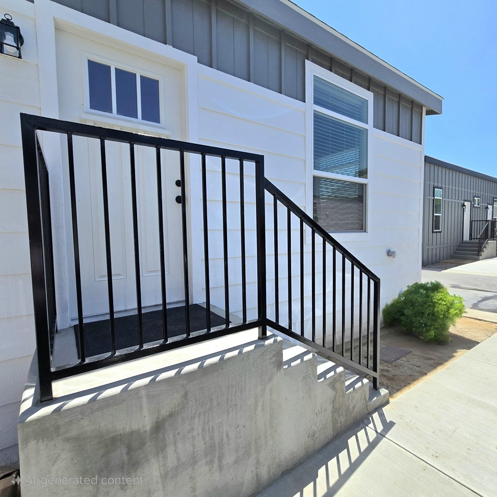 A black metal railing on a concrete staircase.