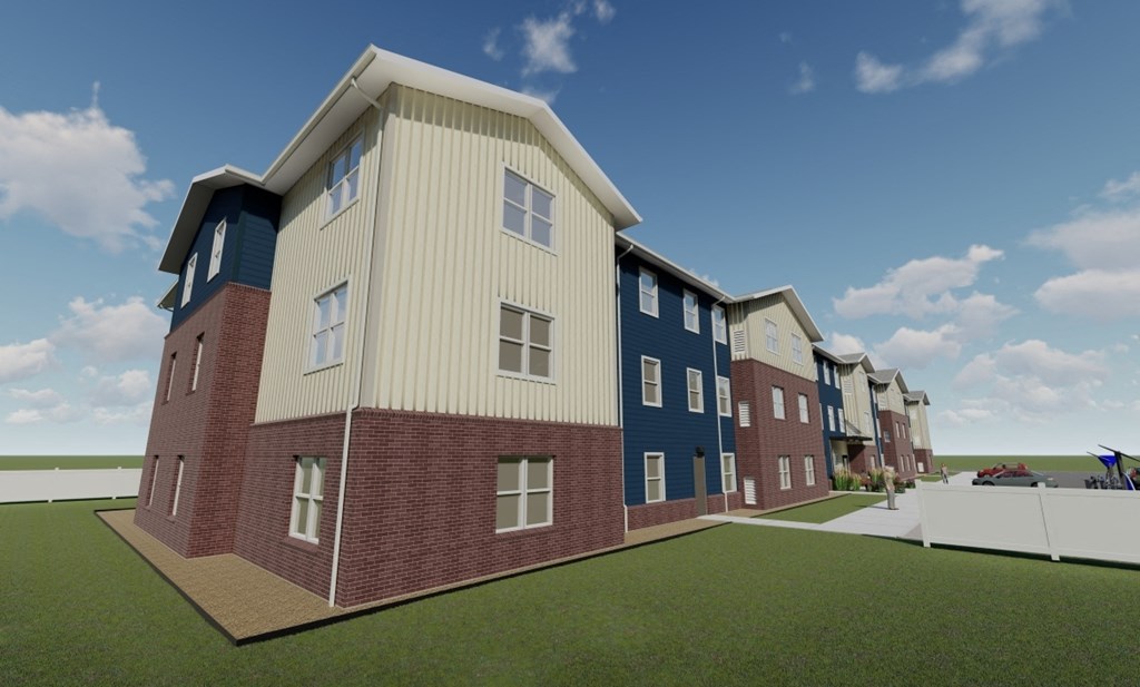 A row of modern townhouses with a mix of brick and siding exteriors.