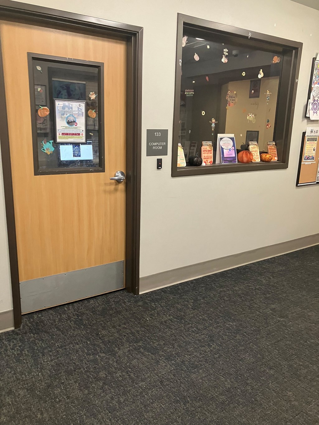 A wooden door with a glass window on the other side.