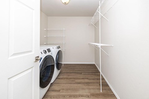 A laundry room with a washer and dryer.