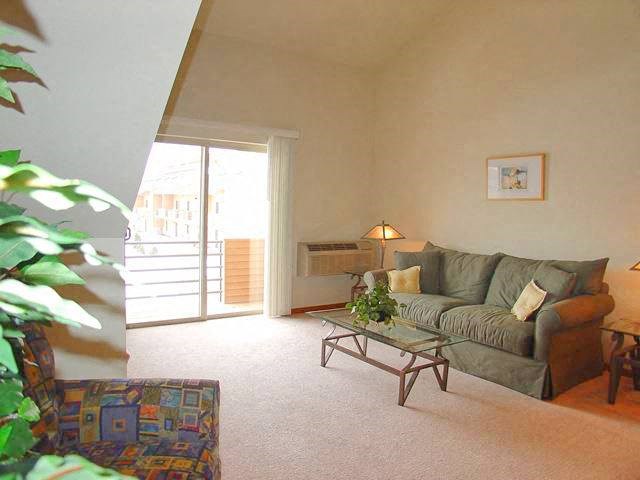 a living room with a couch and a table