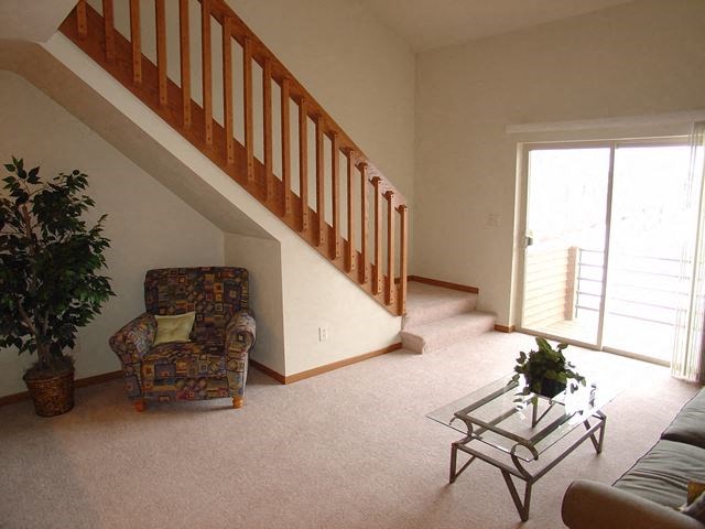 a living room with a chair and a table
