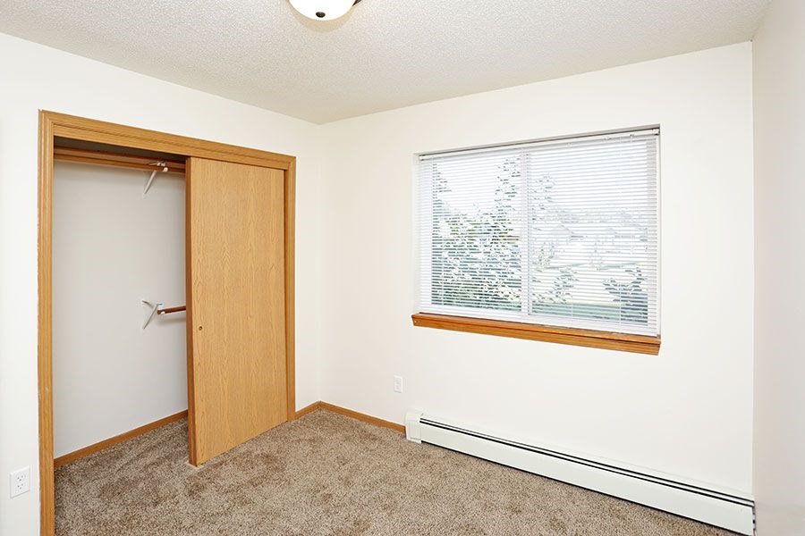 A room with a window and a door.