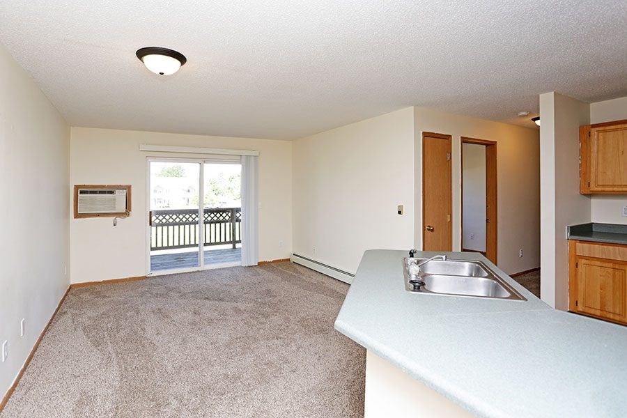 A room with a sink and a window.