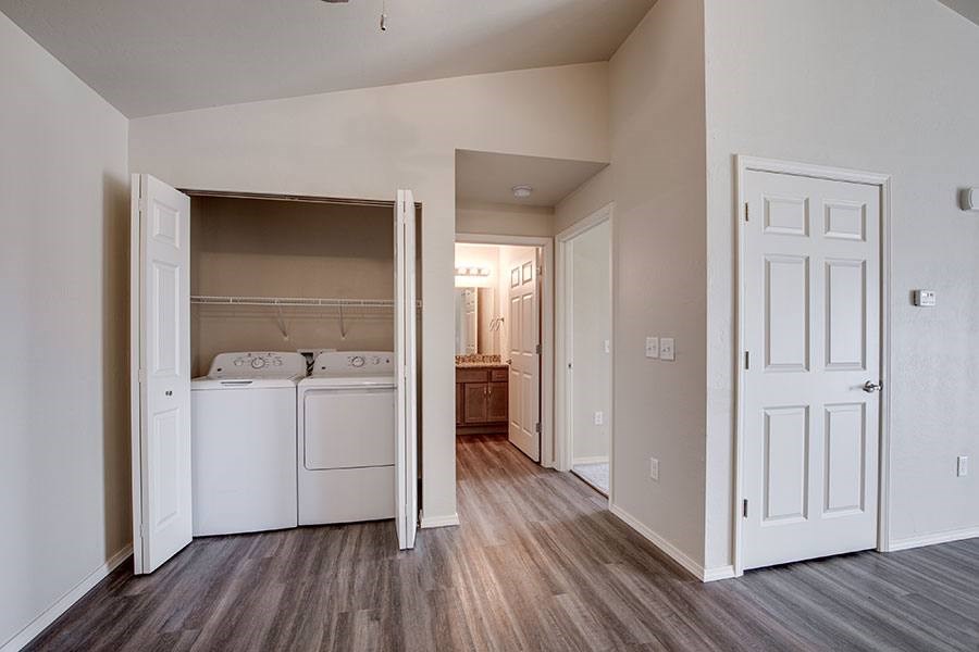 A laundry room with a washer and dryer in it.