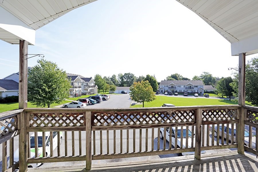 A view from a porch looking down a street.