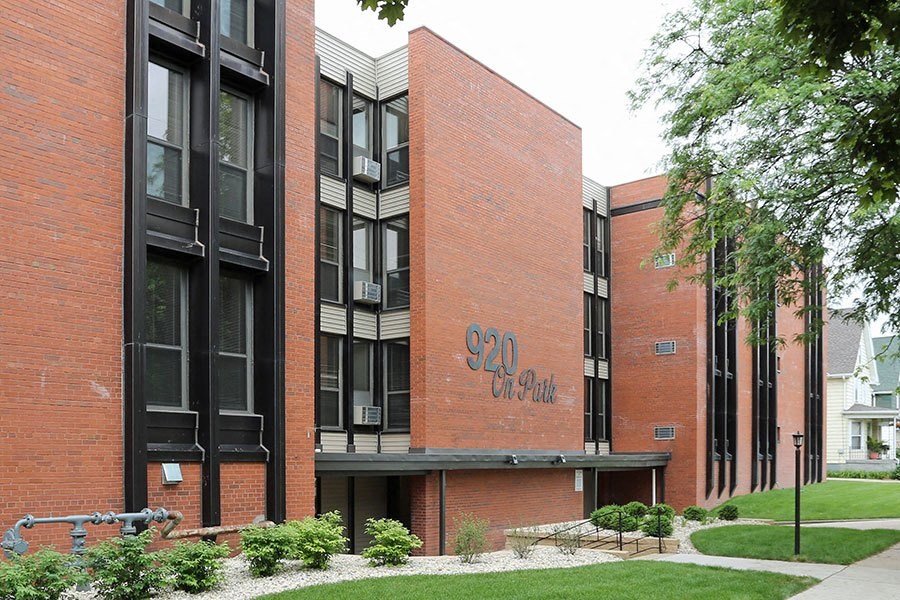 a large brick building with graffiti on it