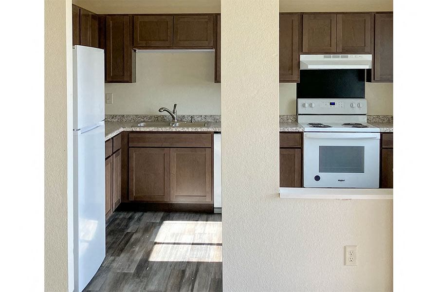 a kitchen with a stove microwave and a refrigerator