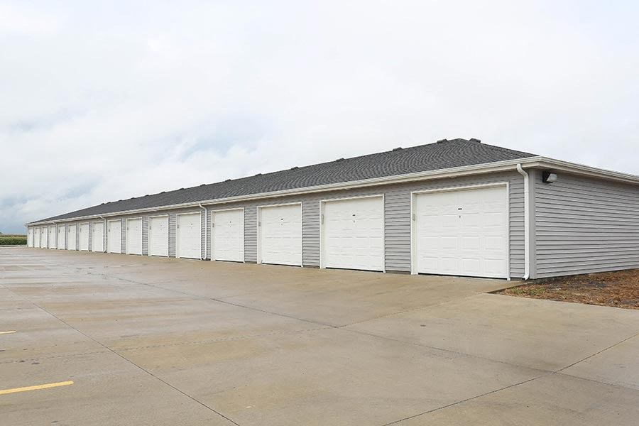 a row of garage doors on the side of a building